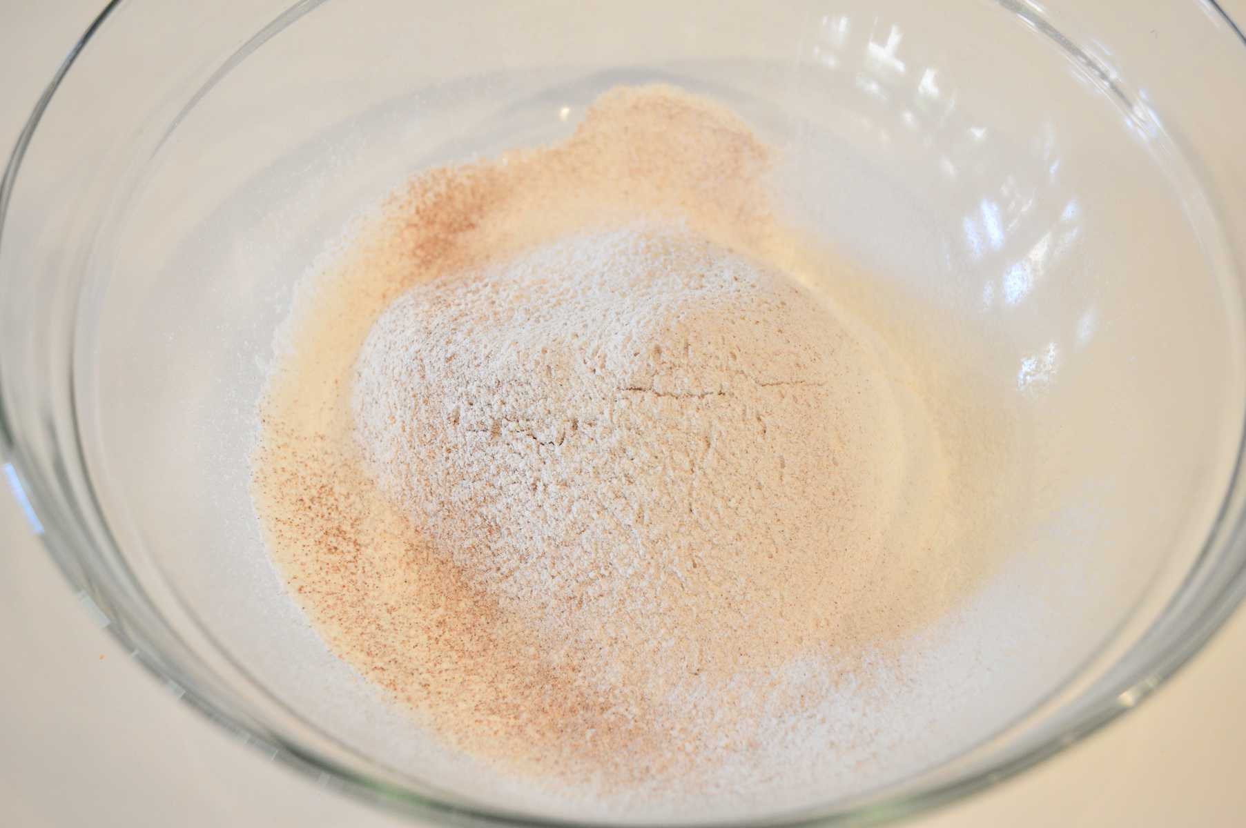 glass bowl full of dry ingredients 