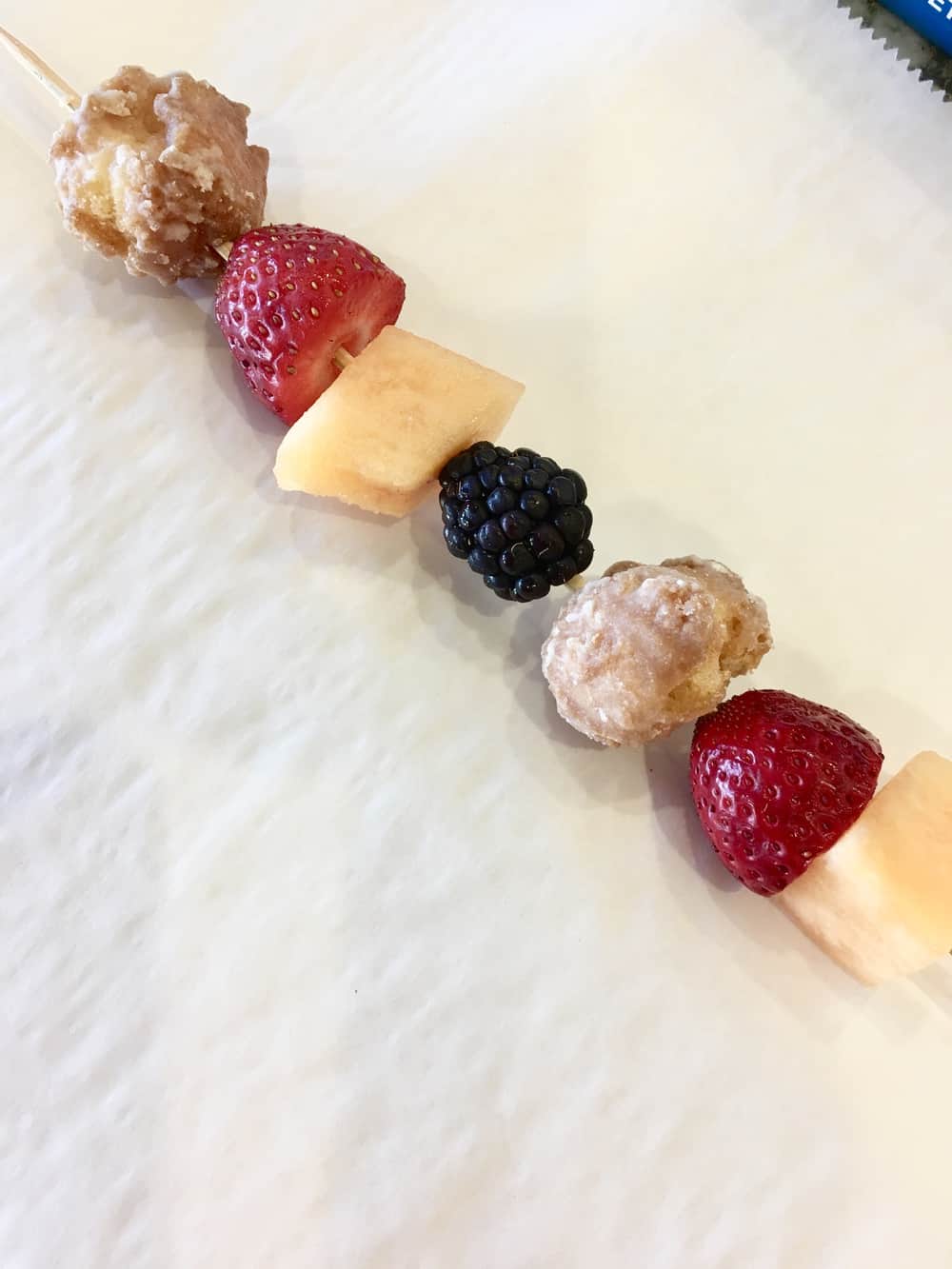 Donut and Fruit Skewers Kabobs are an easy recipe to serve at Baby Showers or Bridal Showers. Great as an after school snack too or kids birthday parties. #donut #fruit #skewer #babyshowerfood #bridalshowerfood #easyrecipe #dessert #appetizer #simpledish #footballfood #afterschoolsnack