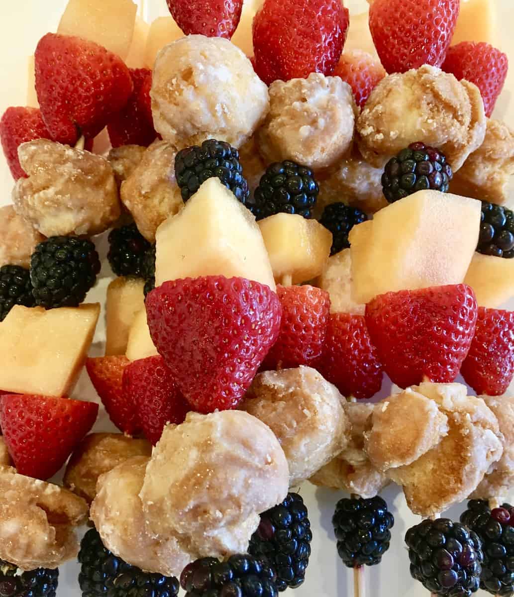 Donut and Fruit Skewers Kabobs are an easy recipe to serve at Baby Showers or Bridal Showers. Great as an after school snack too or kids birthday parties. #donut #fruit #skewer #babyshowerfood #bridalshowerfood #easyrecipe #dessert #appetizer #simpledish #footballfood #afterschoolsnack