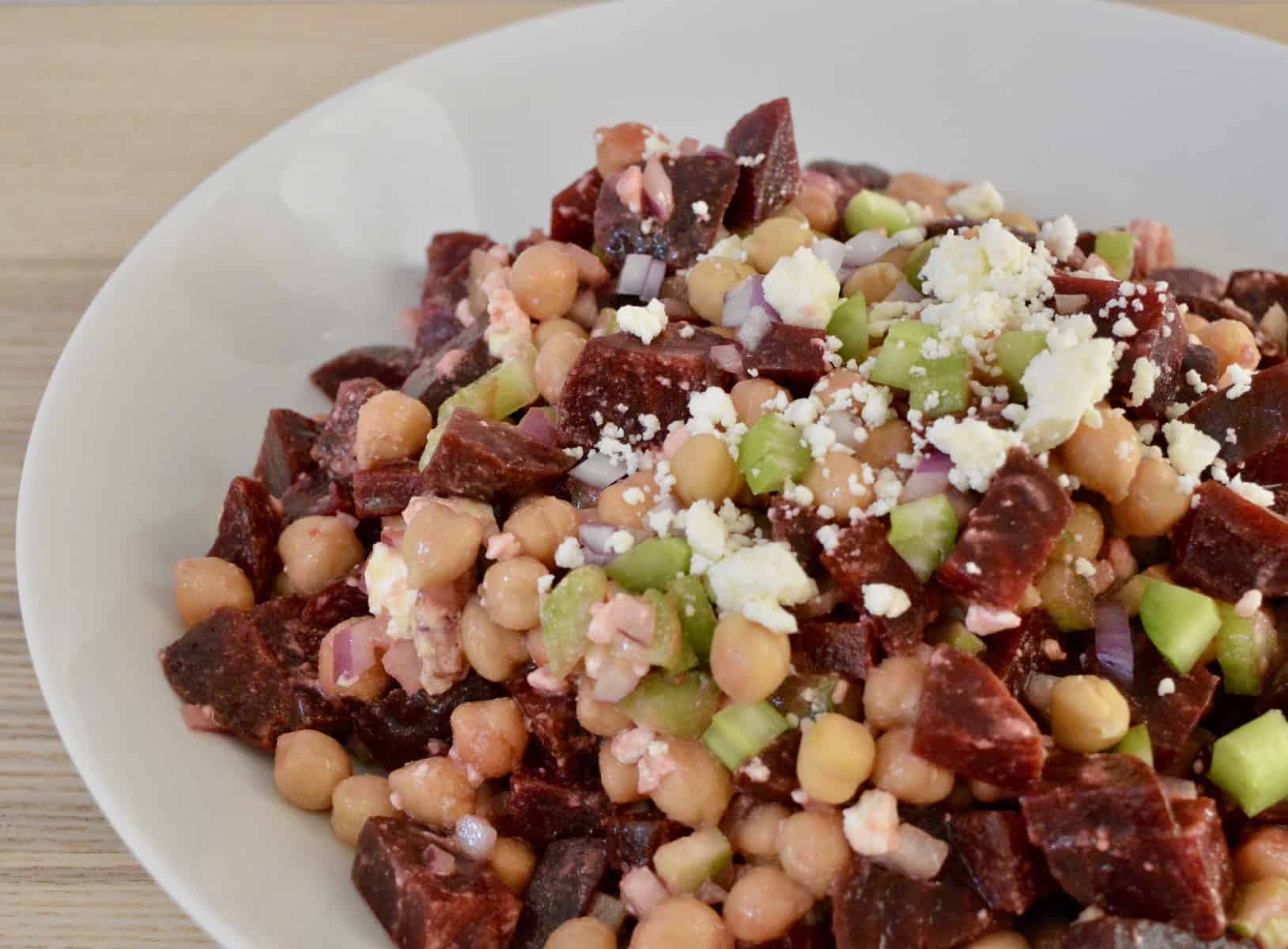 Beet Salad with Garbanzo Beans in a white bowl. 