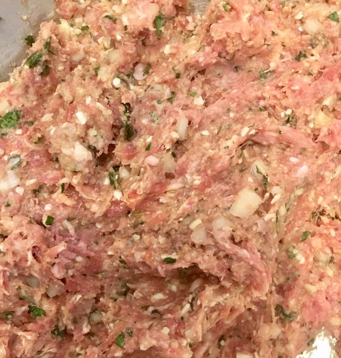 close up of raw meat for the turkey meatballs. 