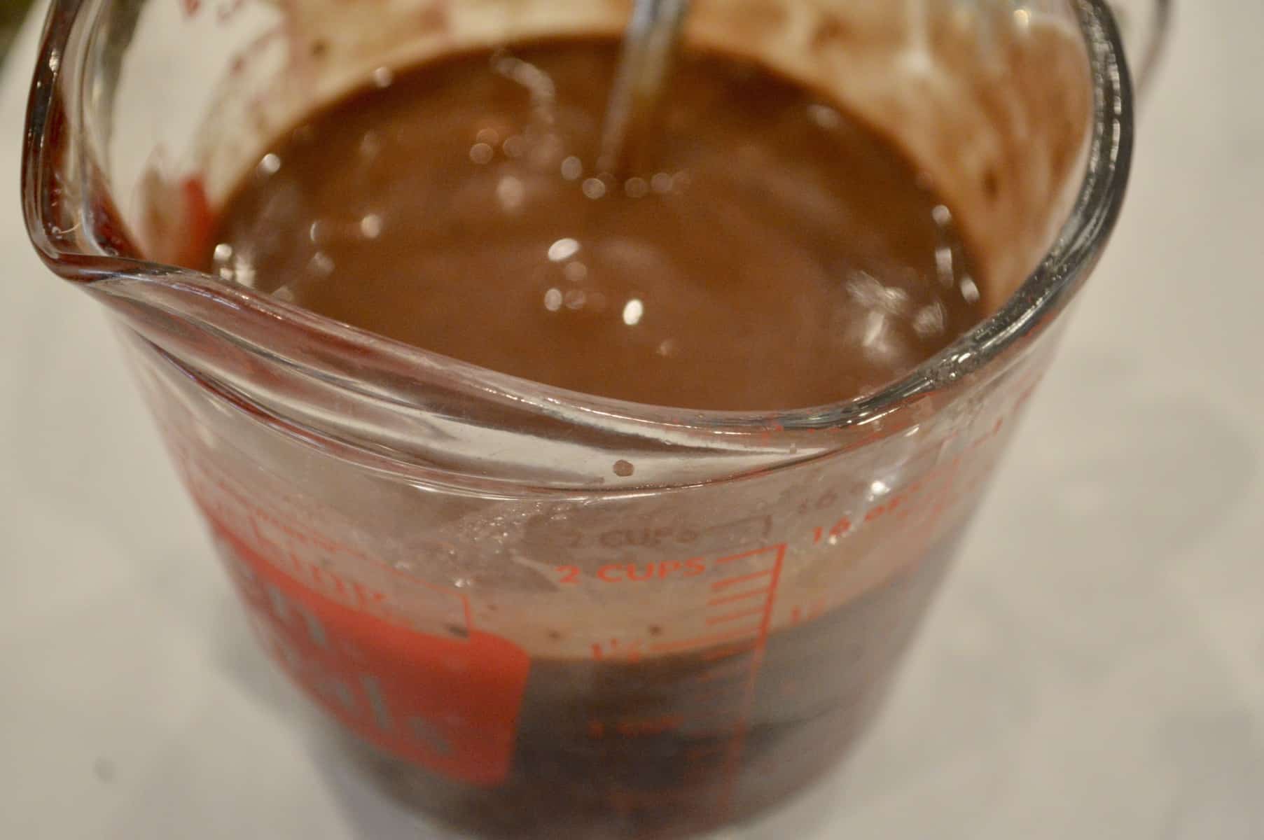 measuring cup of melted chocolate 