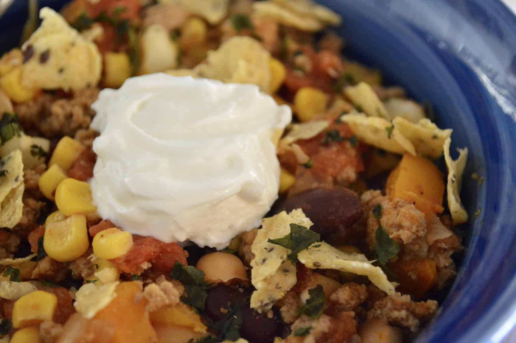 Healthy Turkey Chili with Hominy and Beans and greek yogurt on top