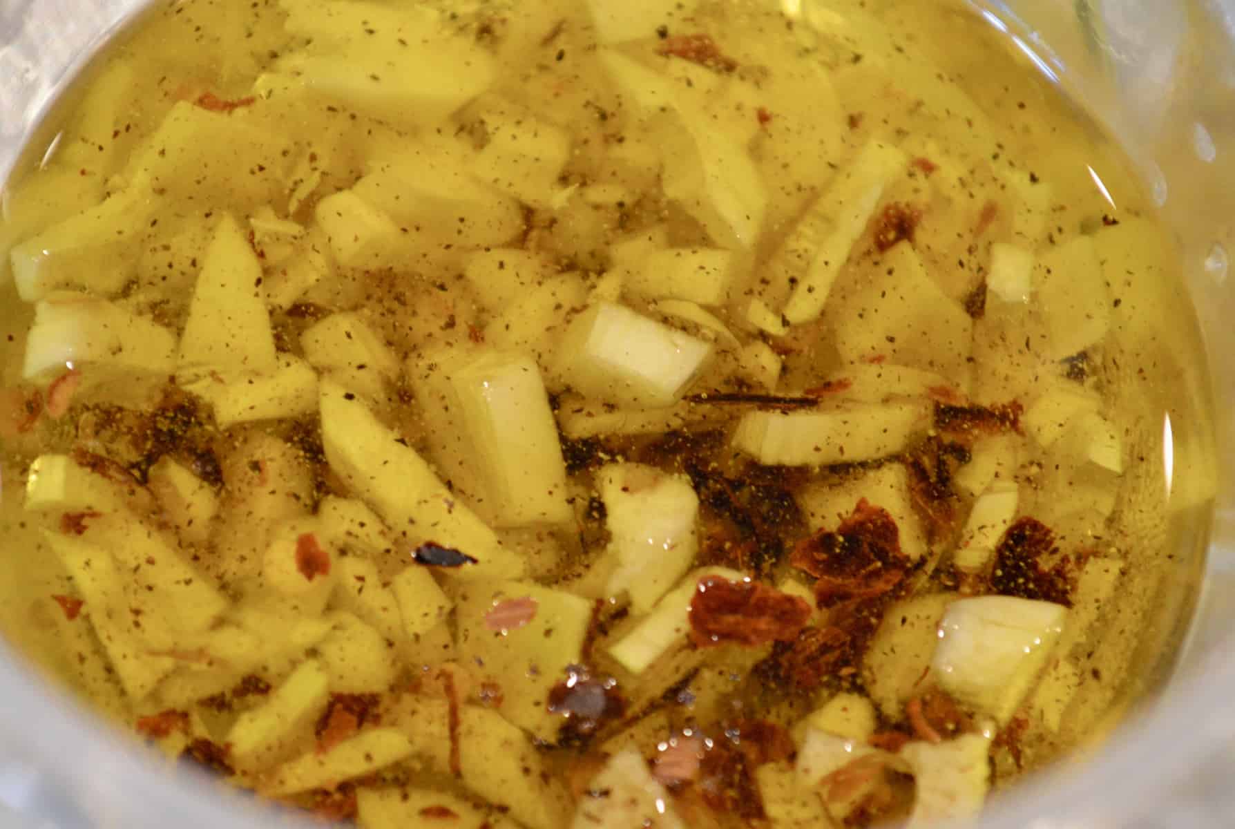 garlic drizzling oil in a bowl. 