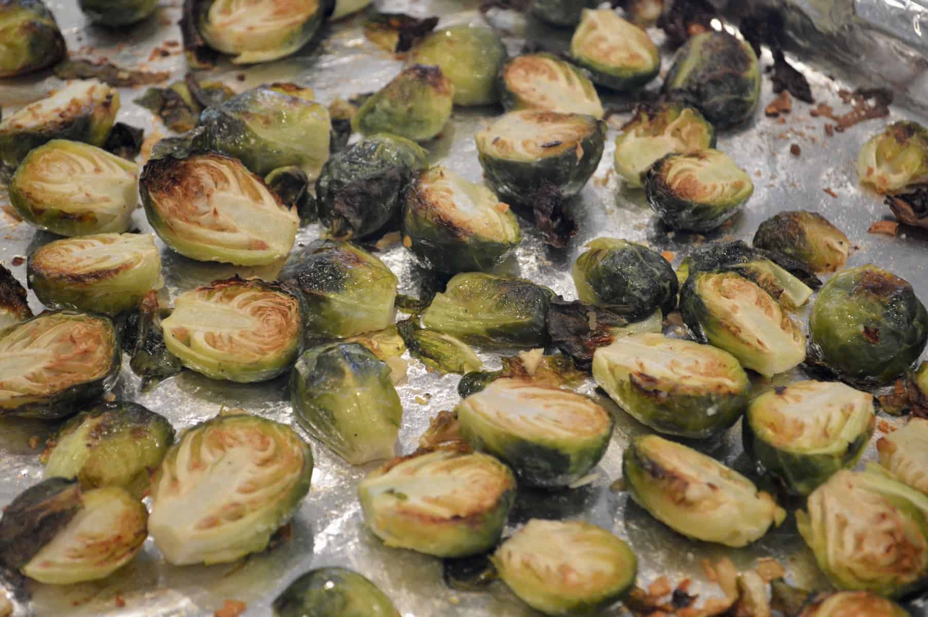 roasted Brussels sprouts with garlic out of the oven on a sheet pan