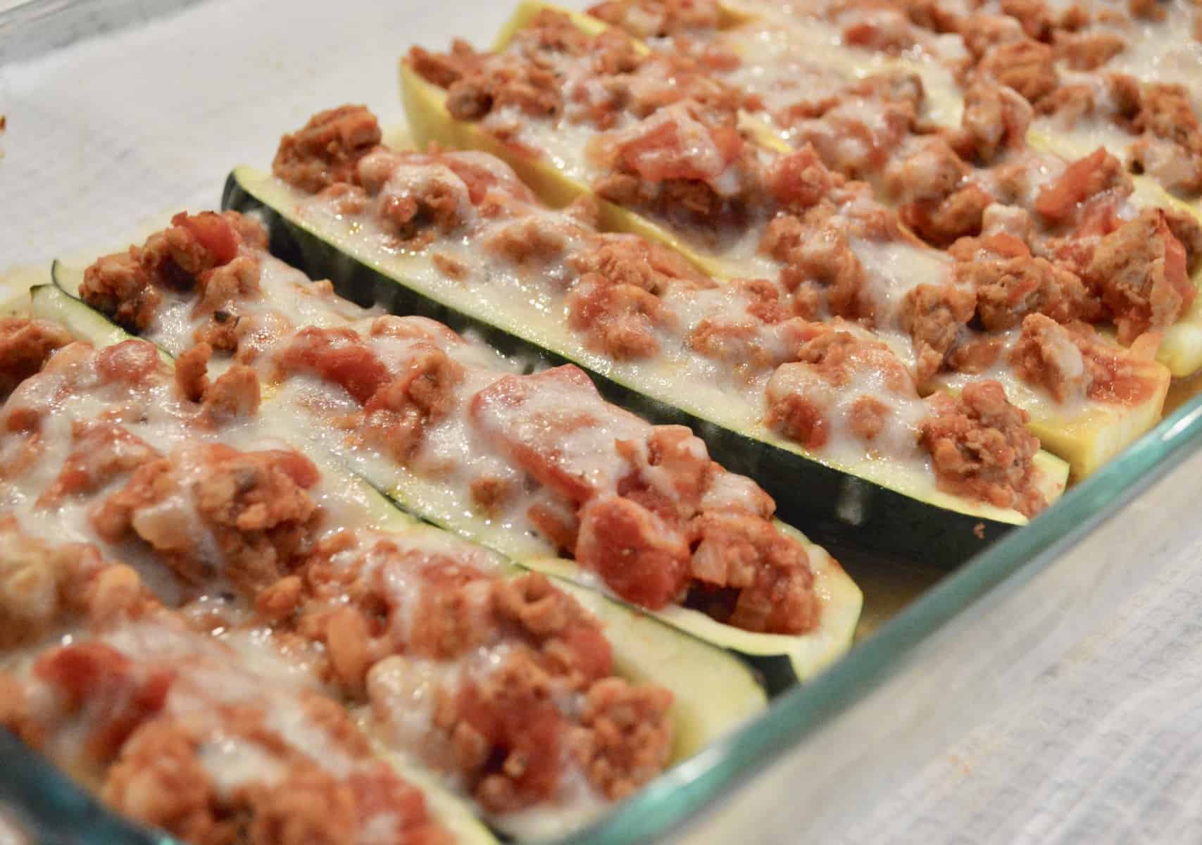 Healthy, low-carb, low-calorie and so easy to make, don't miss these delicious Stuffed Zucchini Boats with Yellow Squash filled with lean ground turkey and tasty Italian flavors.  #weeknightdinner #easyrecipe #healthy #lowcarb #lowcalorie #parenting #zucchini #stuffedzucchini #yellowsquash #groundturkey #healthyitalian