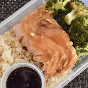 Meal Prep Salmon & Broccoli. Meal prep for the week with this healthy, clean eating, recipe for weight loss. Great for lunch or dinner, this easy Salmon & Broccoli with brown rice and teriyaki sauce is simple and delicious. #mealprep #mealplanning #lunchrecipe #dinnerrecipe #sheetpanrecipe #sesamesalmon #roastedbroccoli #healthy #weightloss #cleaneating #fortheweek