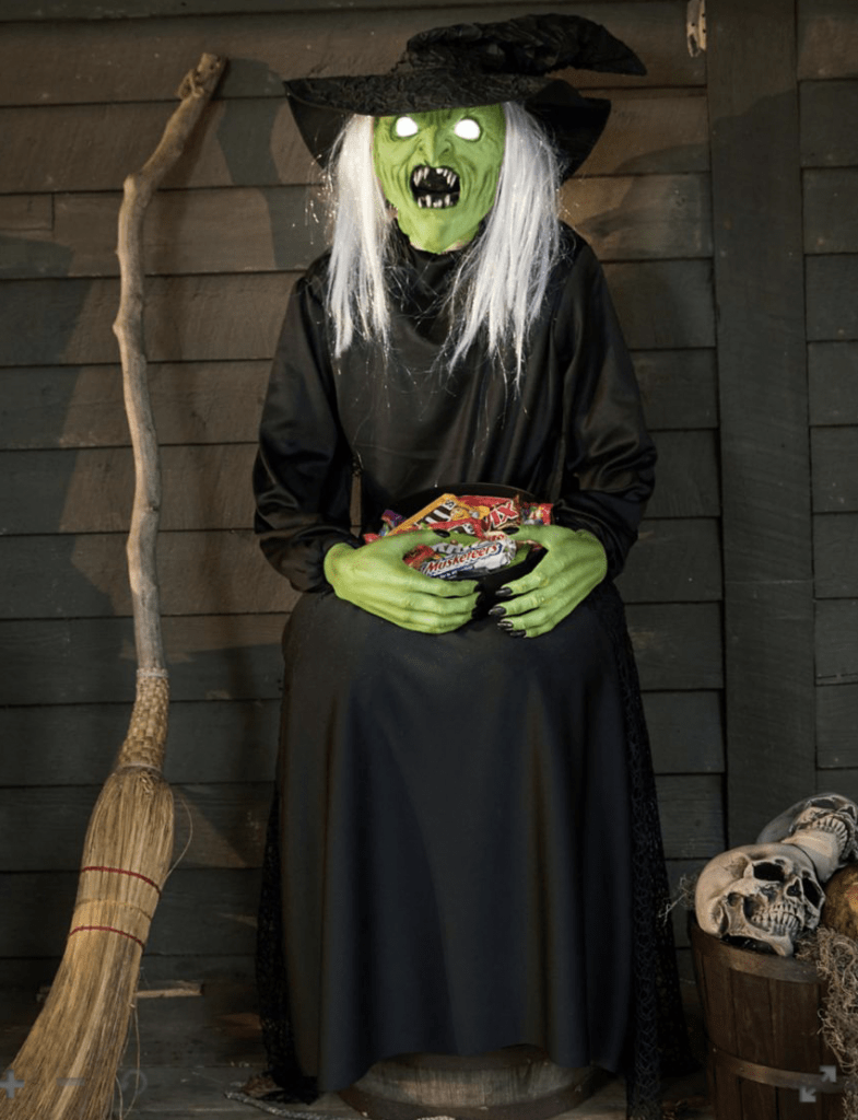 best outdoor halloween decorations including this sitting scare witch animatronic 