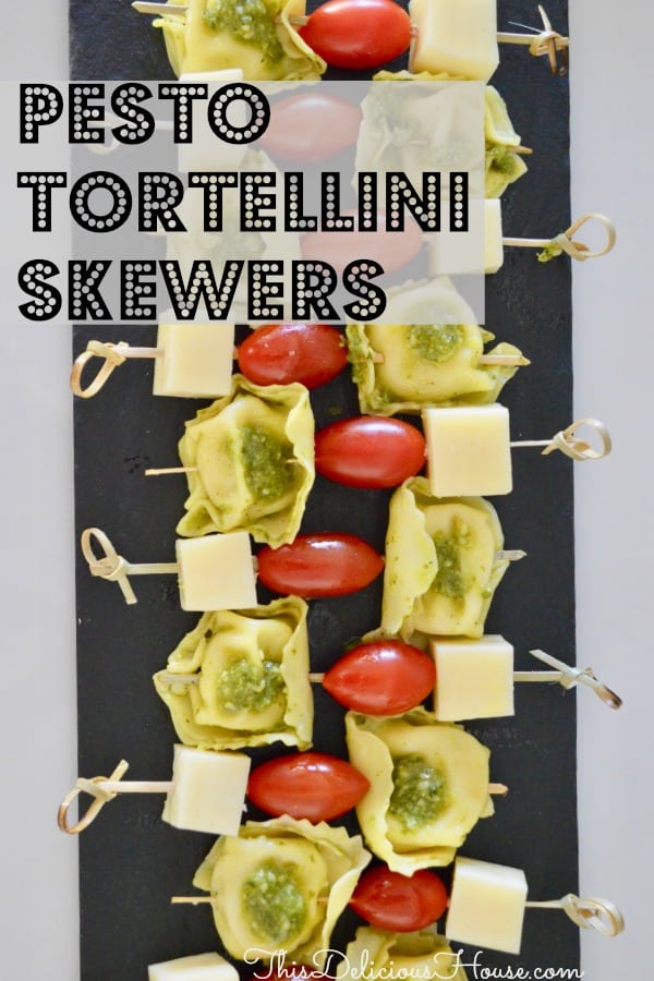 Pesto Tortellini Skewers with cherry tomatoes and provolone cheese on a bamboo skewer