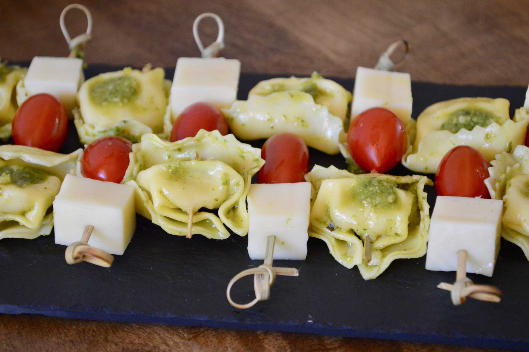 Pesto Tortellini Skewers with provolone and cherry tomatoes 