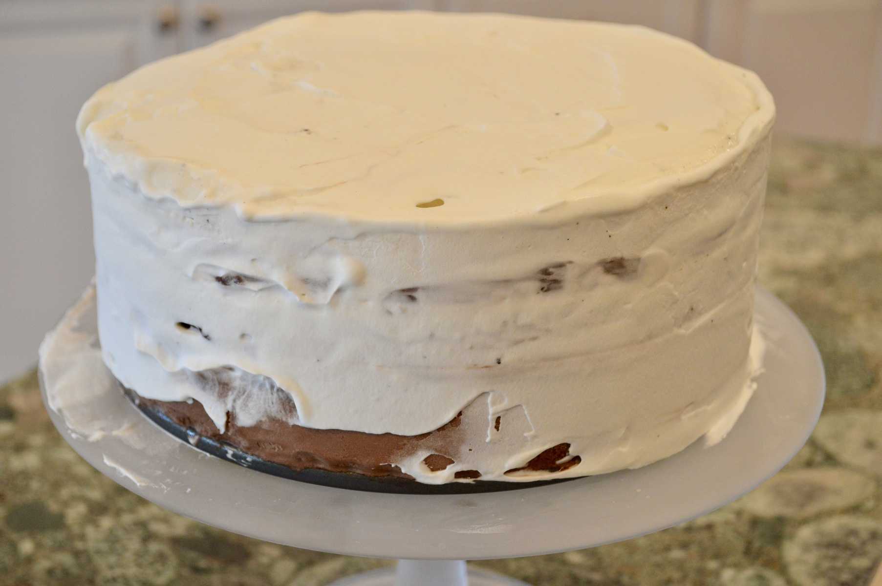 Easy Ice Cream Cake with a thin layer of whipped cream frosting 