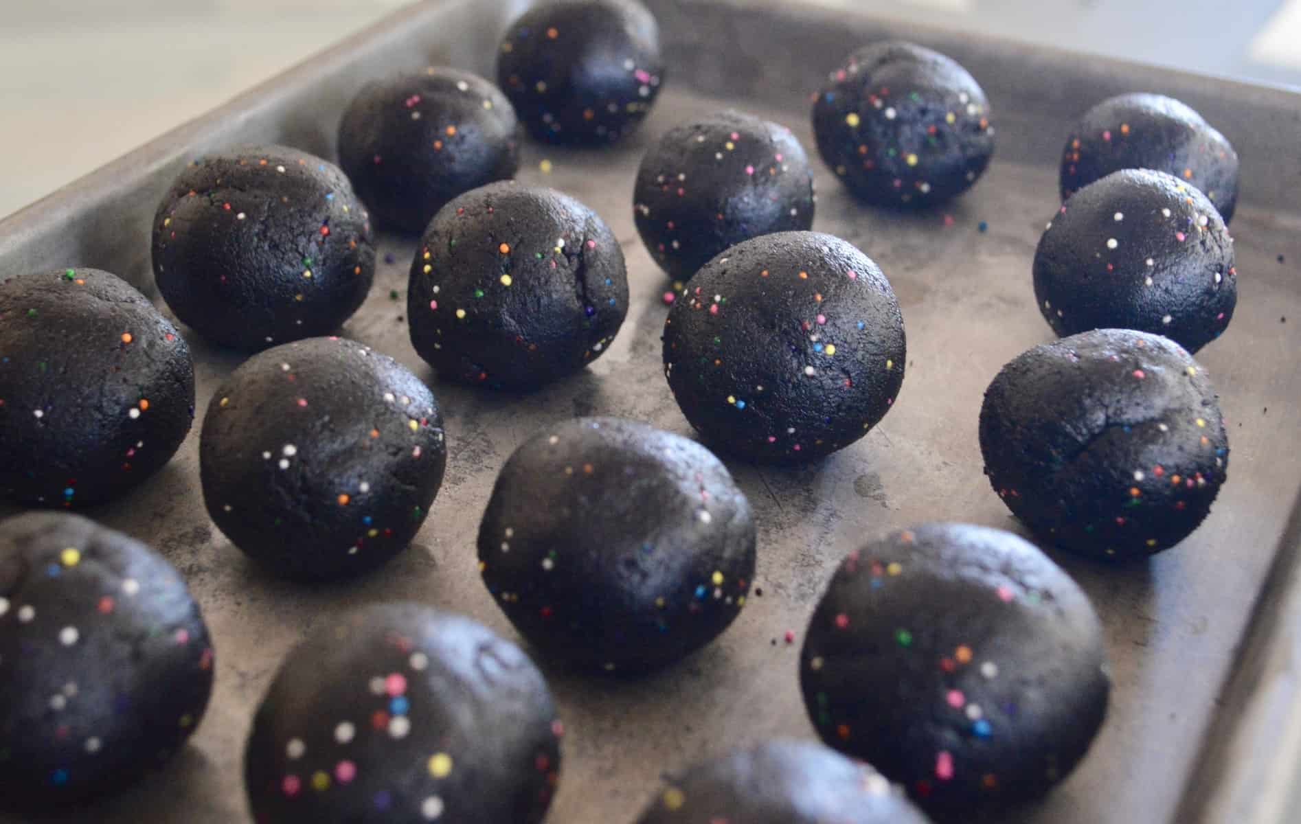 dough balls on a baking sheet. 