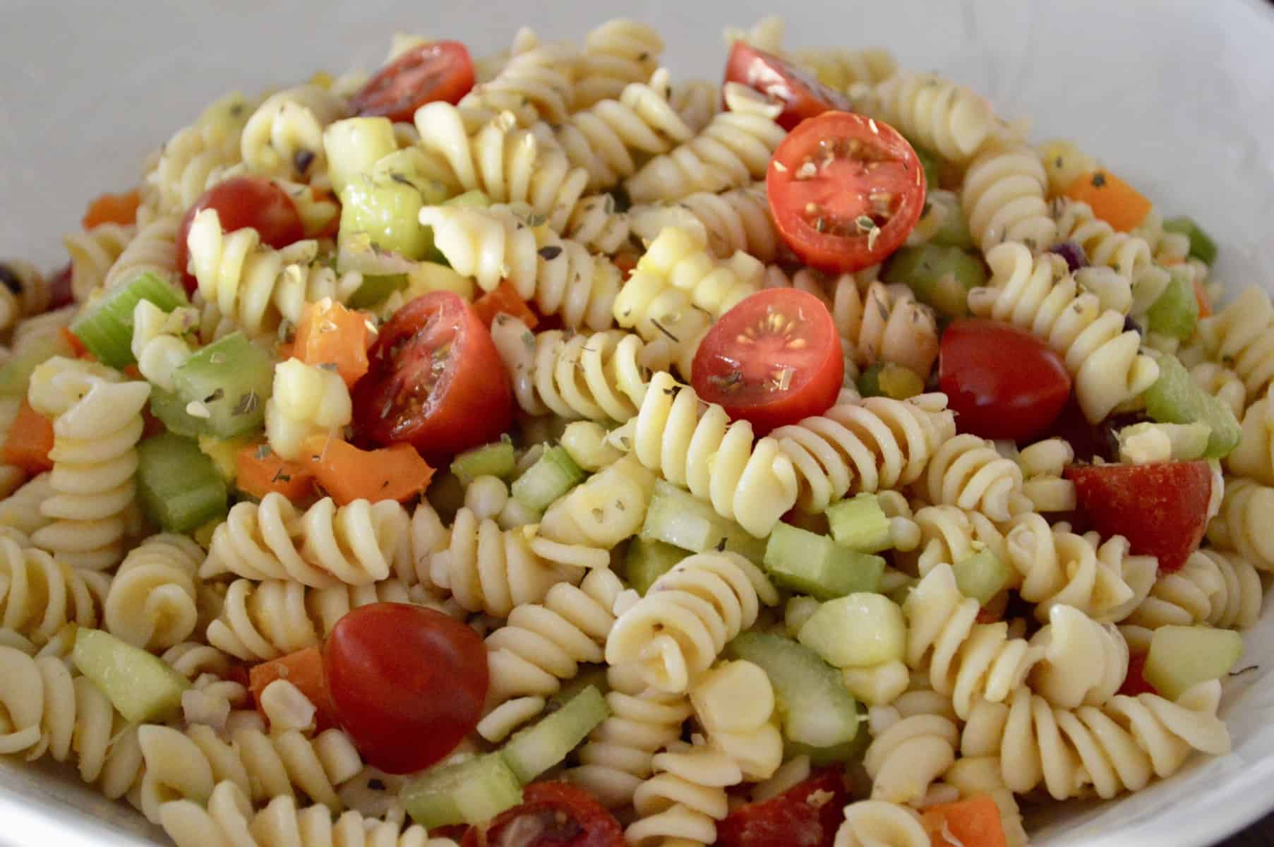 Pasta Salad with Veggies and Corn in a white bowl