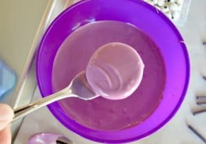 Melted purple Wiltons Candy Melts for Oreo Cookie Spiders