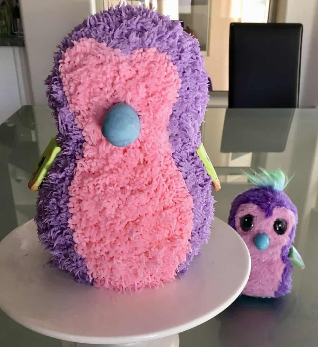 pink and purple frosted Hatchimals cake