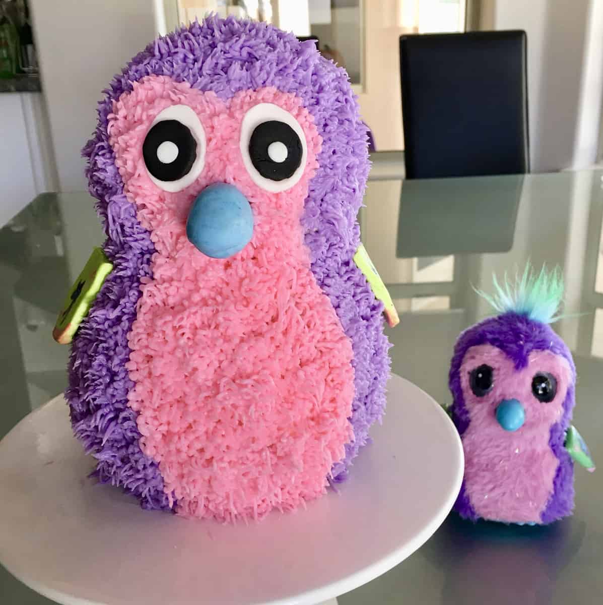 Hatchimals Cake on a white pedestal 