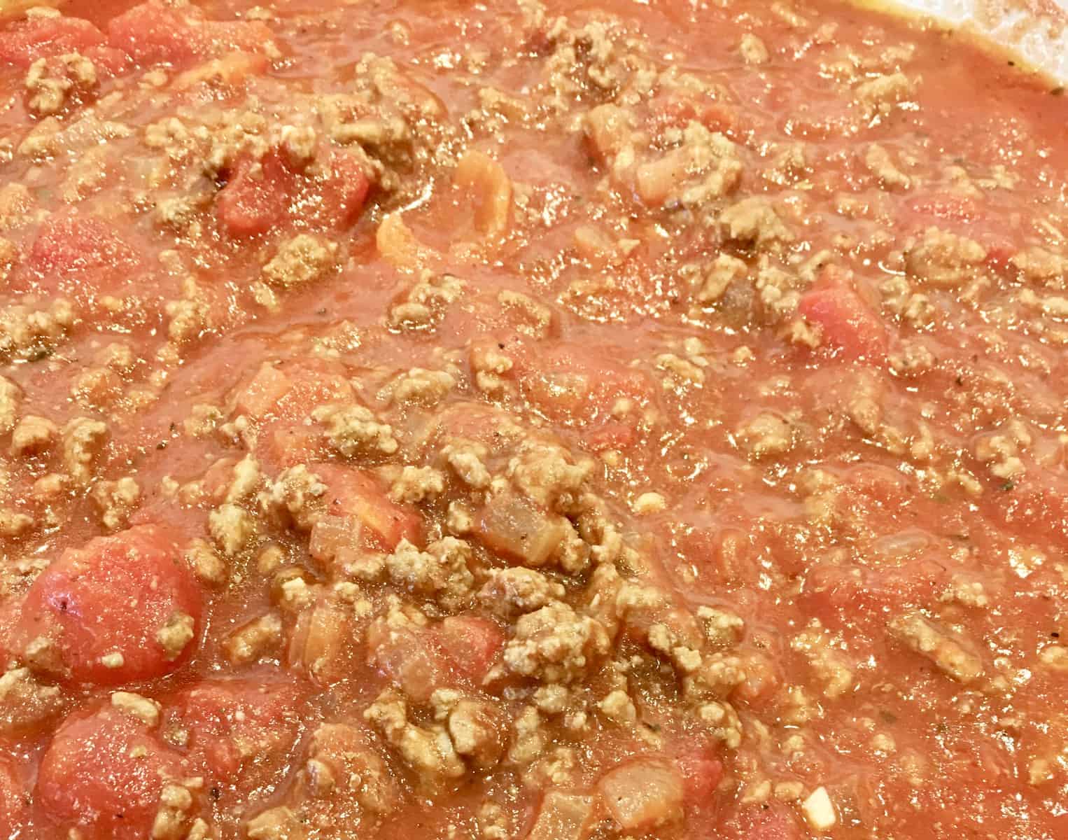 close up of sauce cooking on stovetop. 