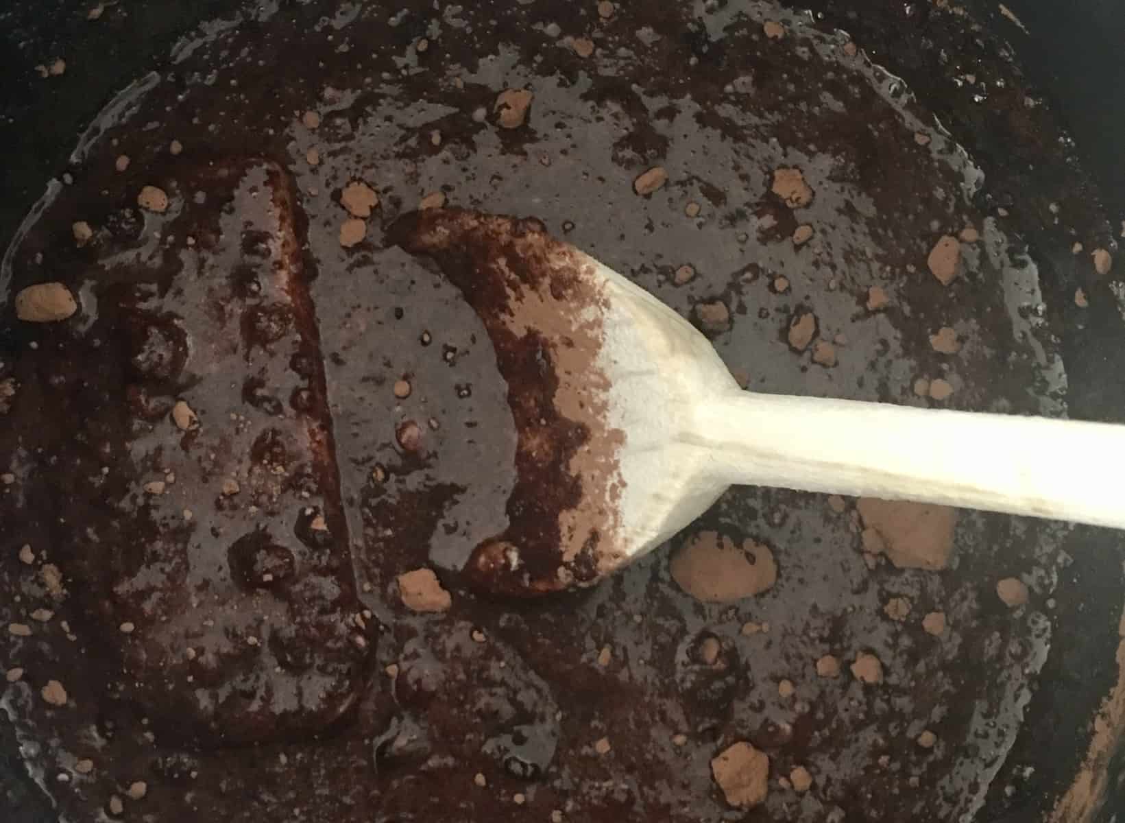 butter, sugar, cocoa powder, and milk, in a saucepan with a wooden spoon. 
