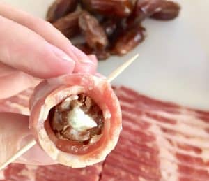 Bacon rolled around the date and secured with a toothpick