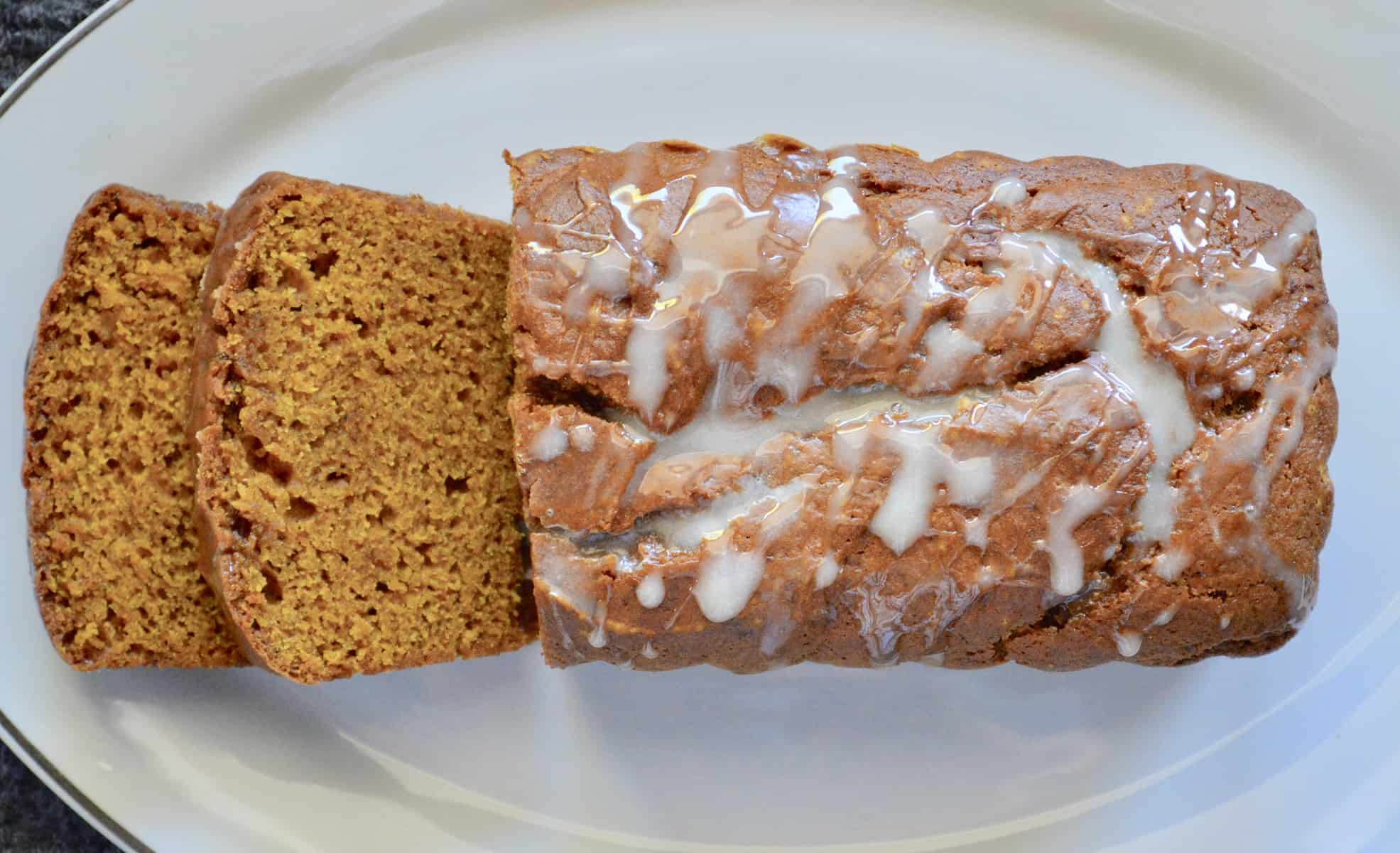 glazed pumpkin bread on a white platter