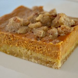 pumpkin pie bars with pecan topping baked in a sheet pan