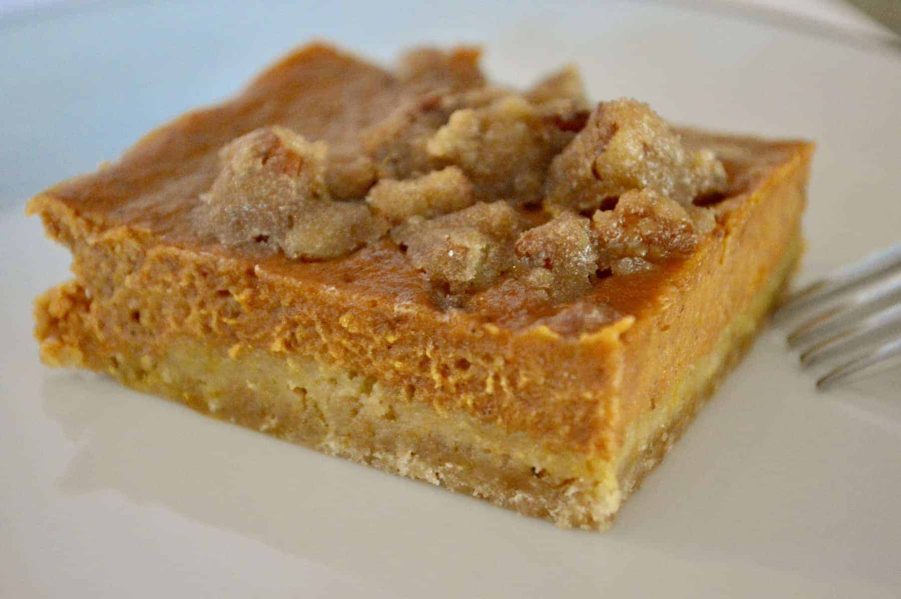 pumpkin pie bars with pecan topping baked in a sheet pan