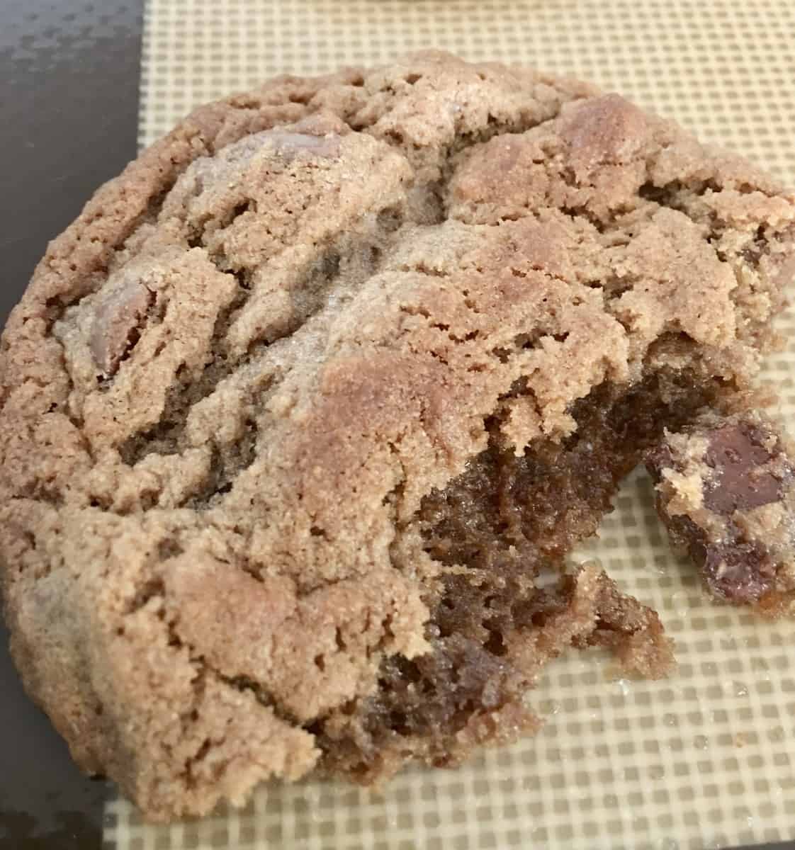 close up of chocolate malt cookies on a baking pad. 