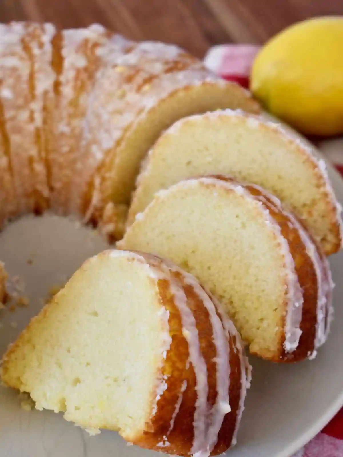 Lemon Ricotta Bundt Cake on white plate. 