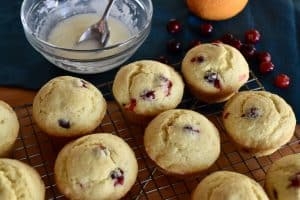 Cranberry orange muffins with glaze on the side.