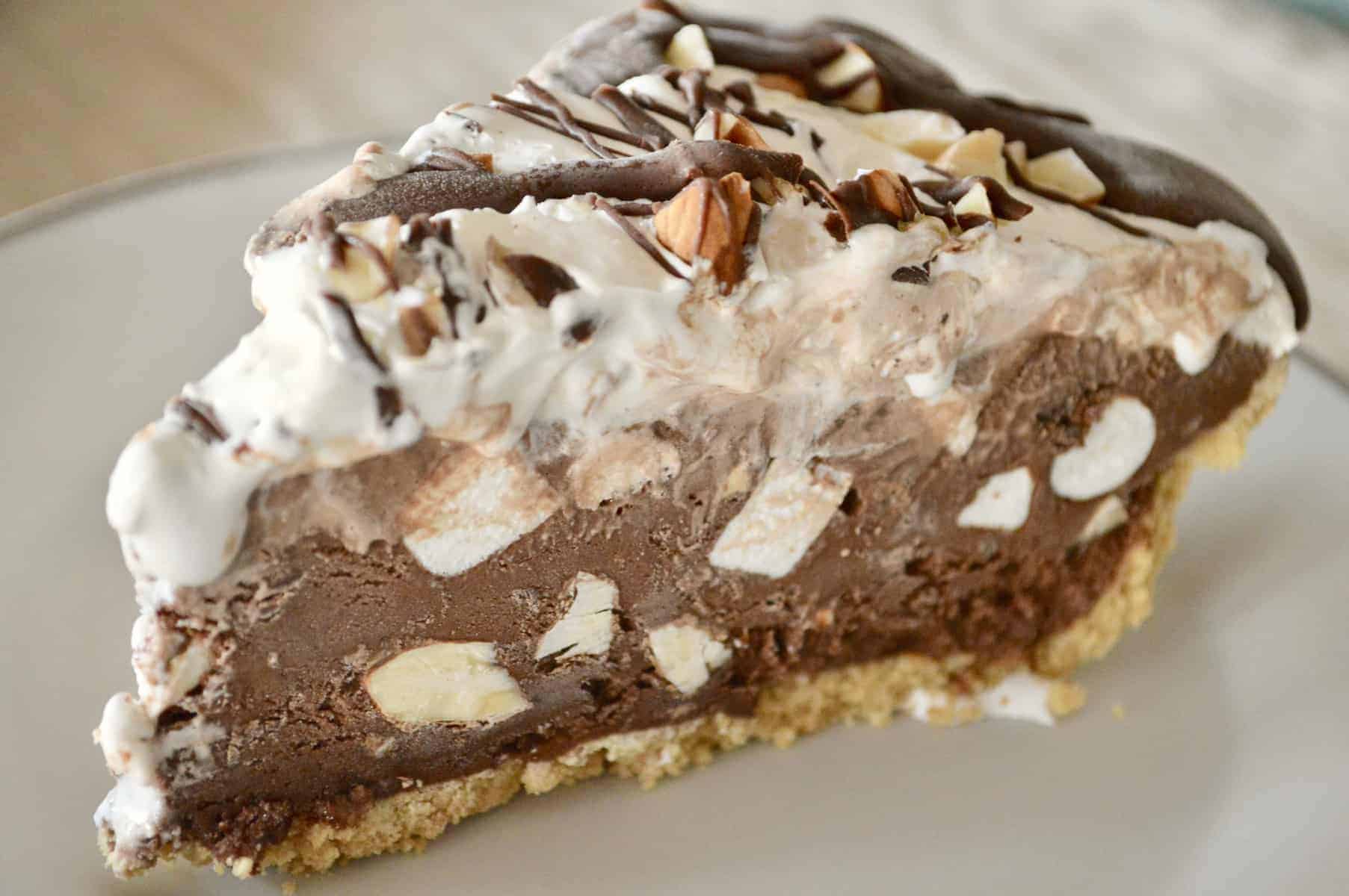 Rocky Road Ice Cream Pie on a white plate. 