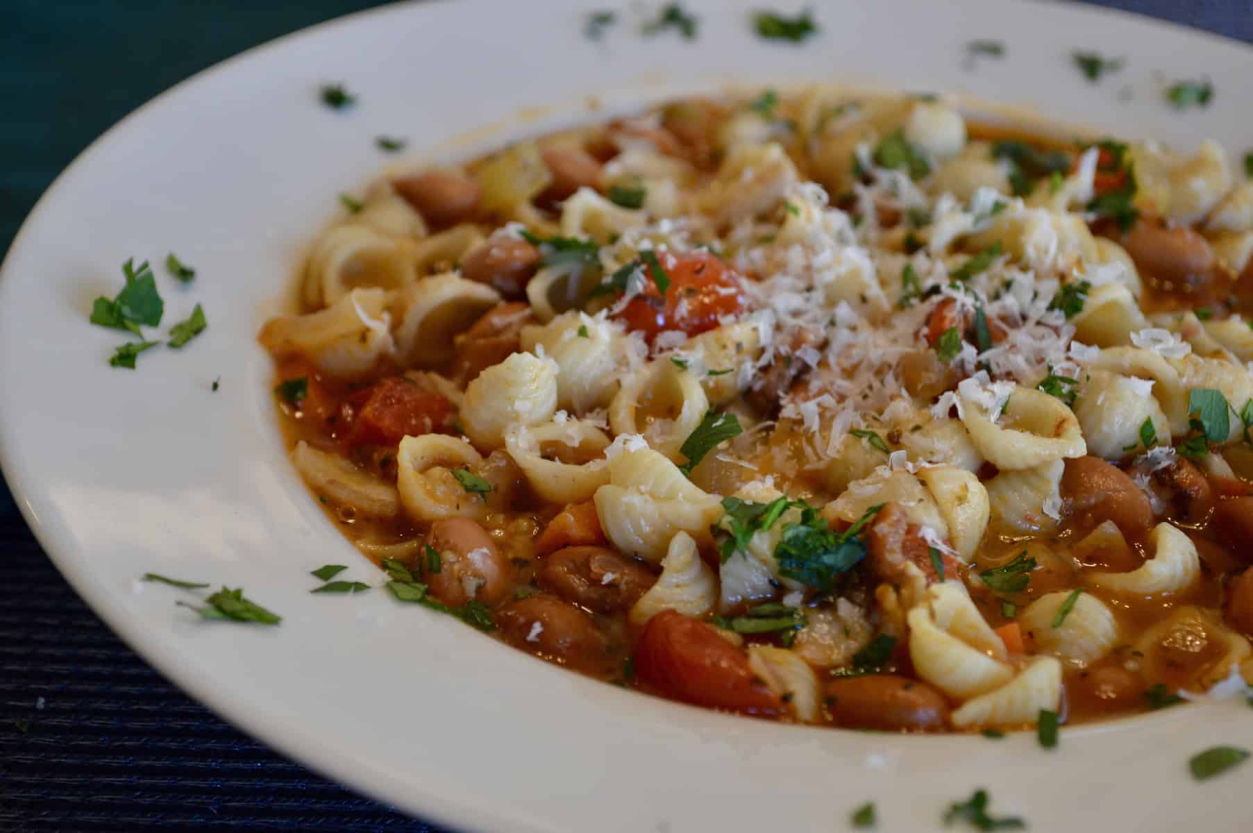 pasta e fagioli soup in a white bowl 