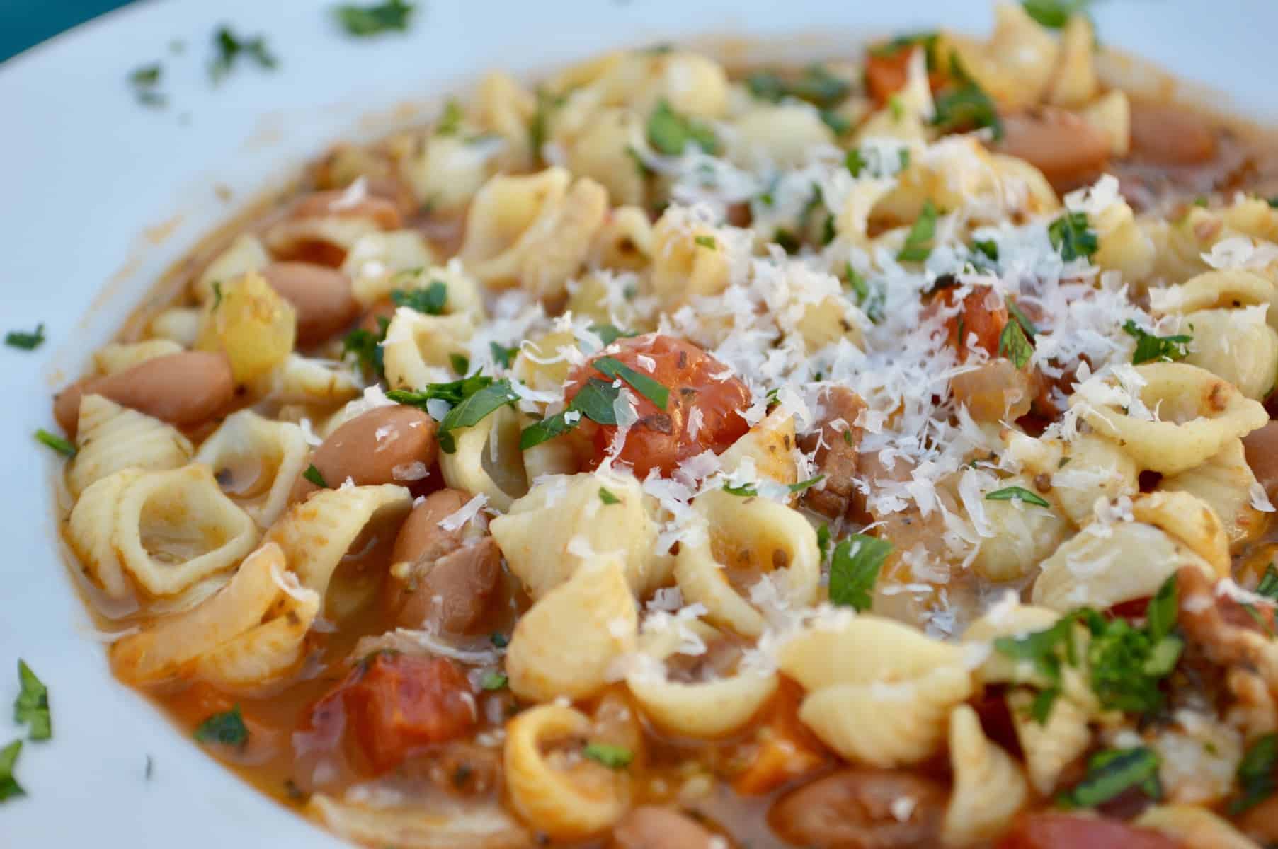 pasta e fagioli soup in a white bowl 