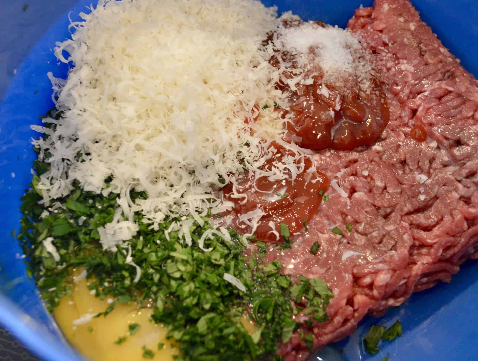 meat mixture in a blue bowl