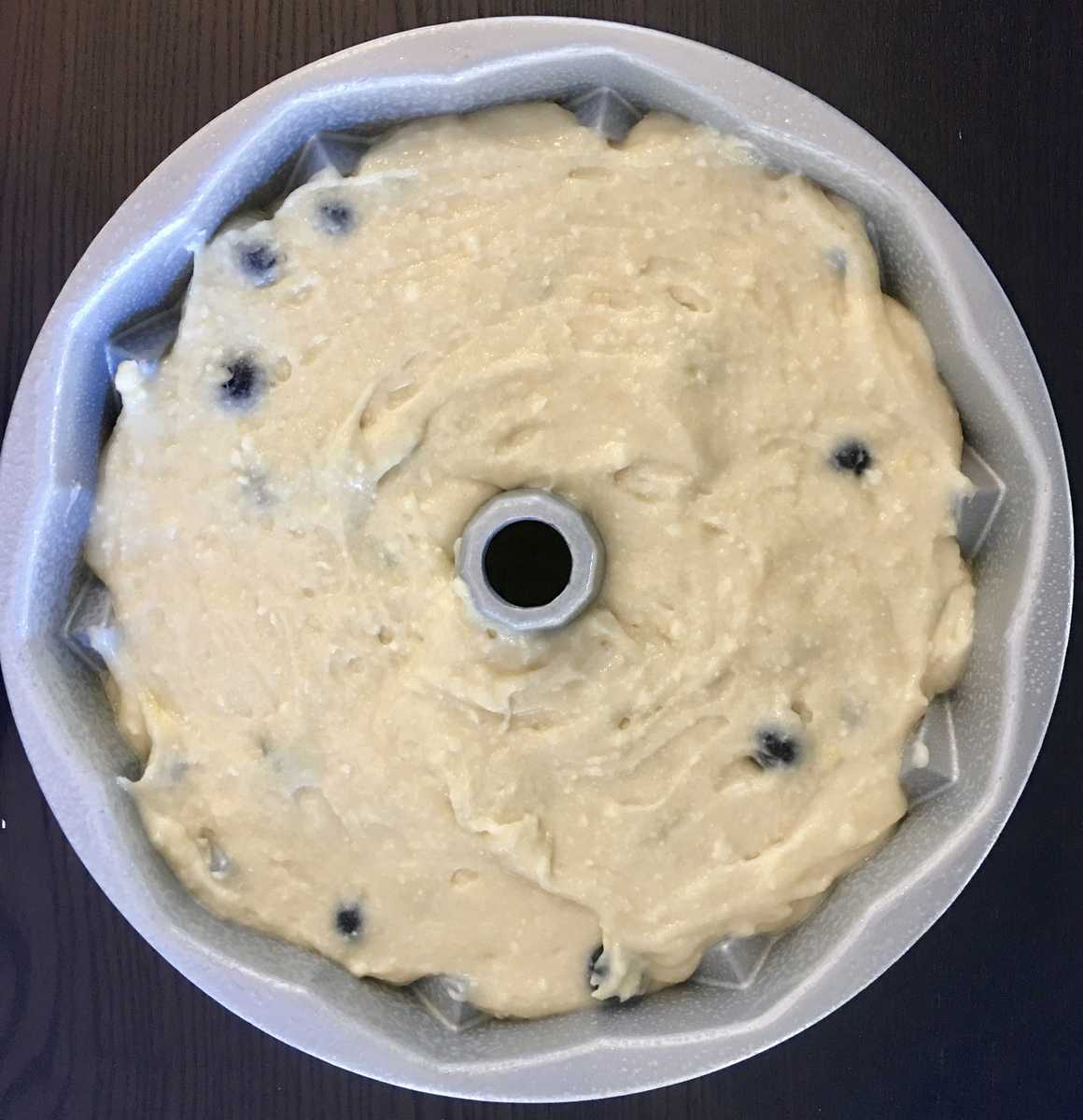 blueberry lemon bundt cake batter in a jubilee bundt cake pan