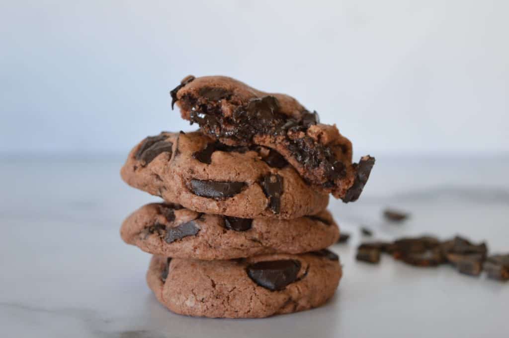 double chocolate pudding cookies stacked on top of each other on a counter
