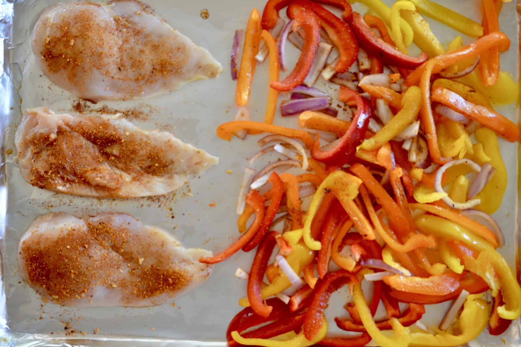 sprinkle taco seasoning on the chicken and bell peppers