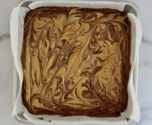 peanut butter swirled atop the brownie layer