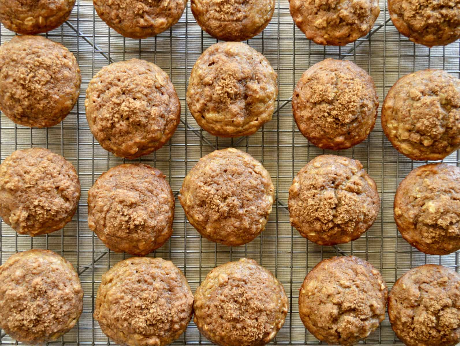 whole wheat banana muffins on a wire rack