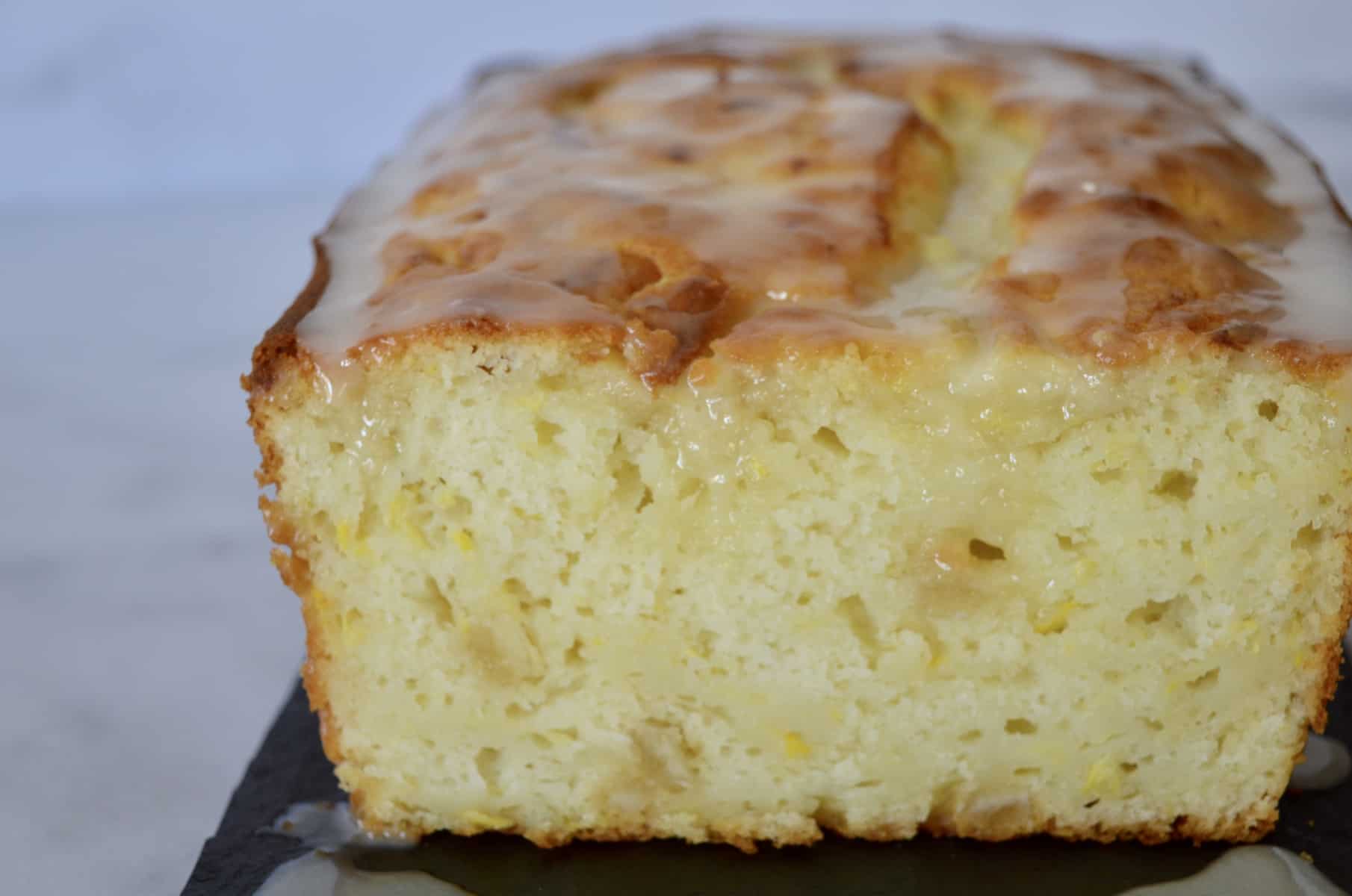 lemon yellow squash bread on a black plate 