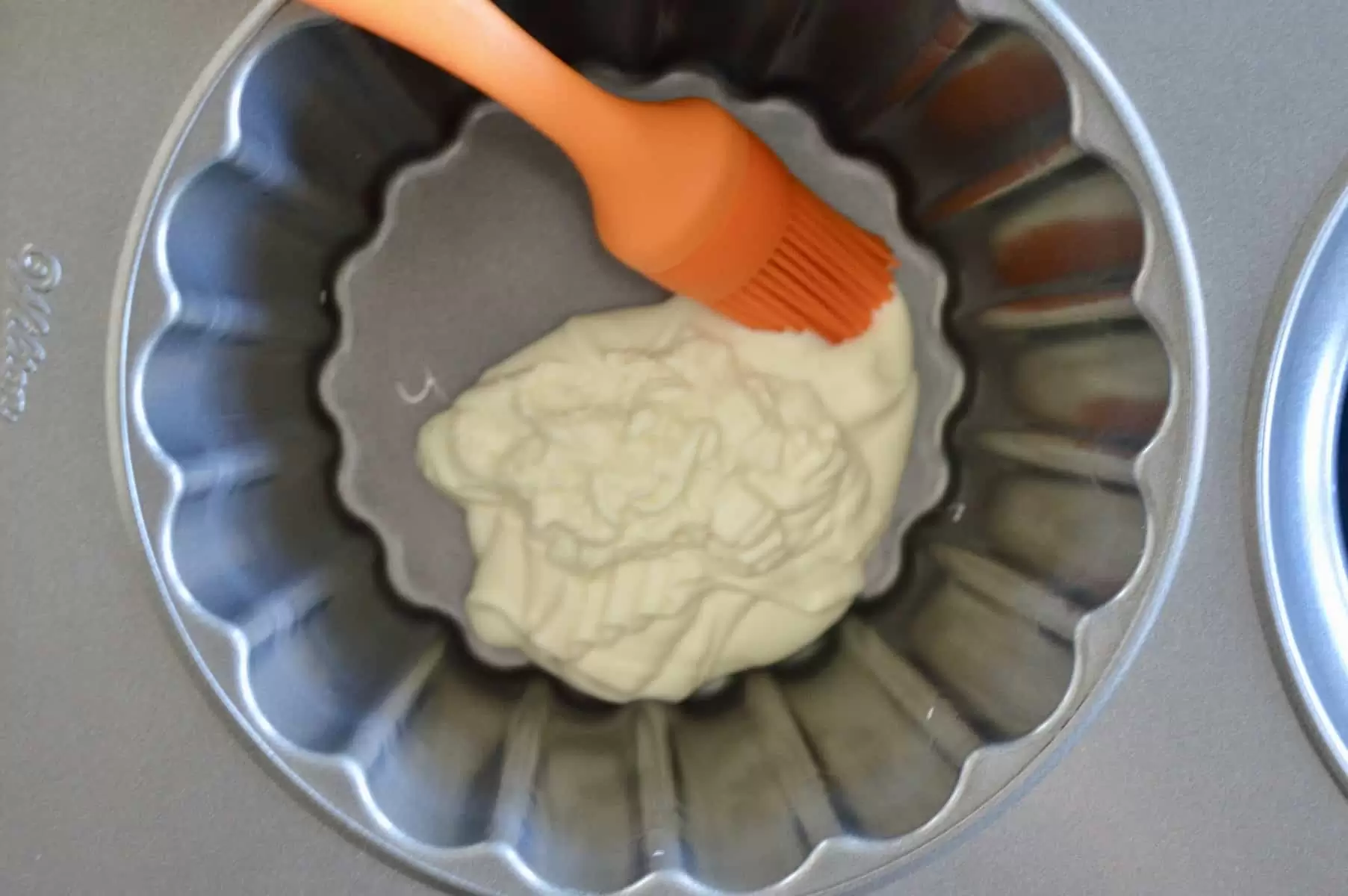 pour the candy coating into the bottom of the cupcake pan 