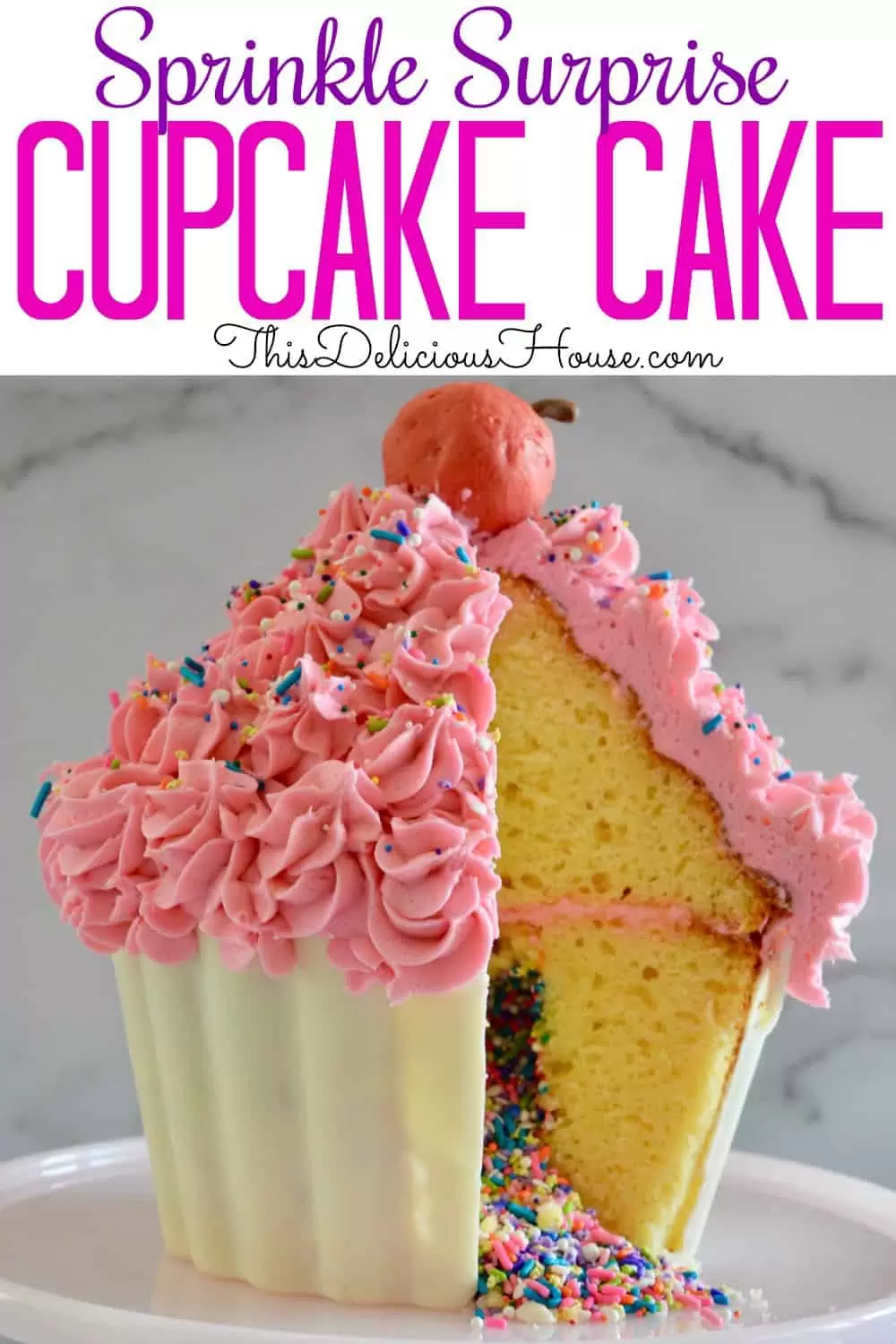 giant cupcake cake with sprinkles in the middle and a truffle cherry on top 