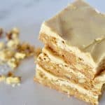frosted butterscotch blondies stacked on each other