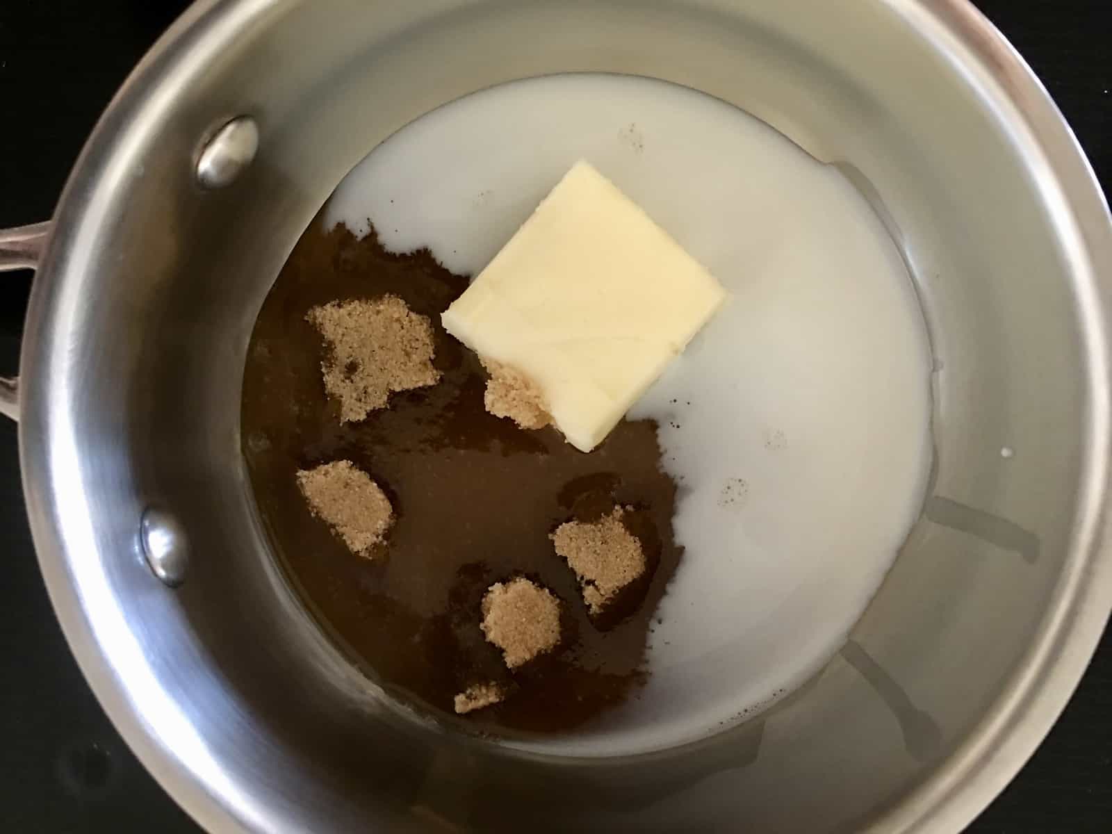 saucepan with butter, brown sugar, and milk in it. 