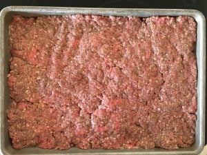 ground beef in a baking pan.