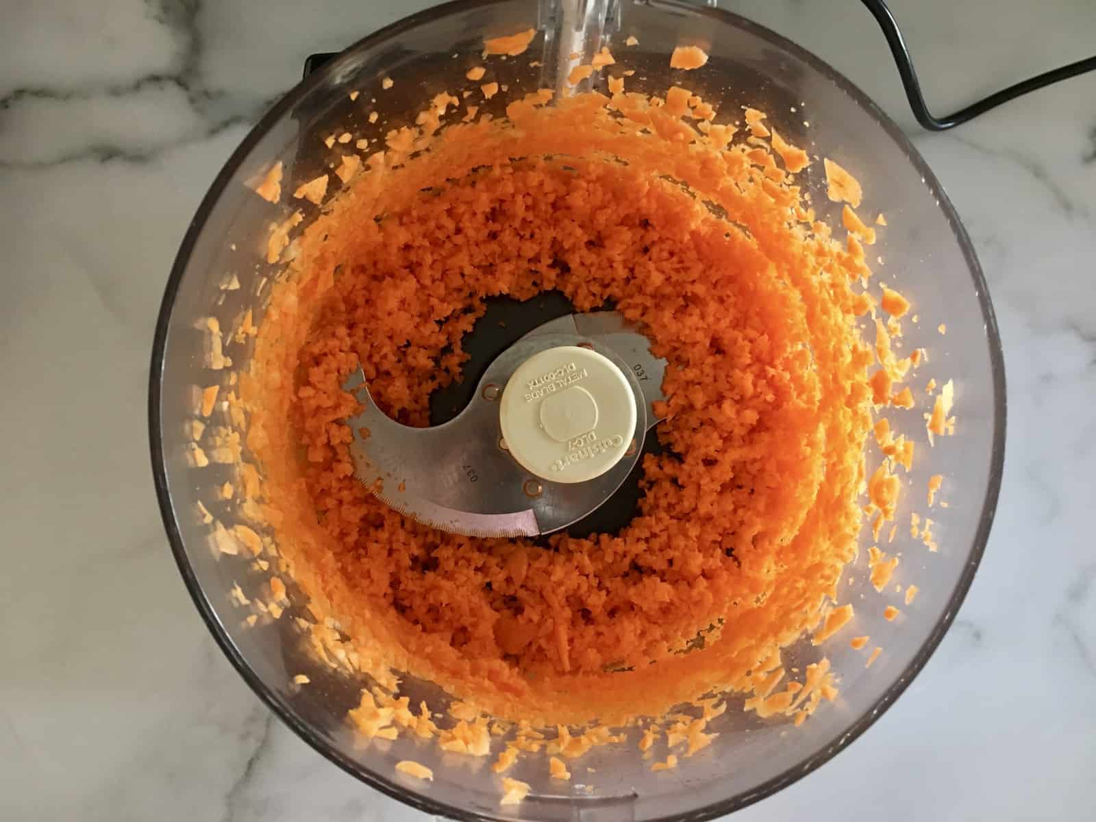 shredded carrot in a food processor