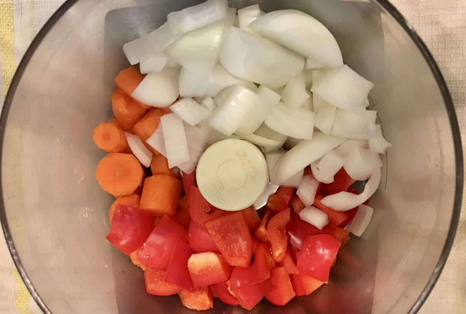 onions, carrots, and bell pepper chunks in a food processor. 