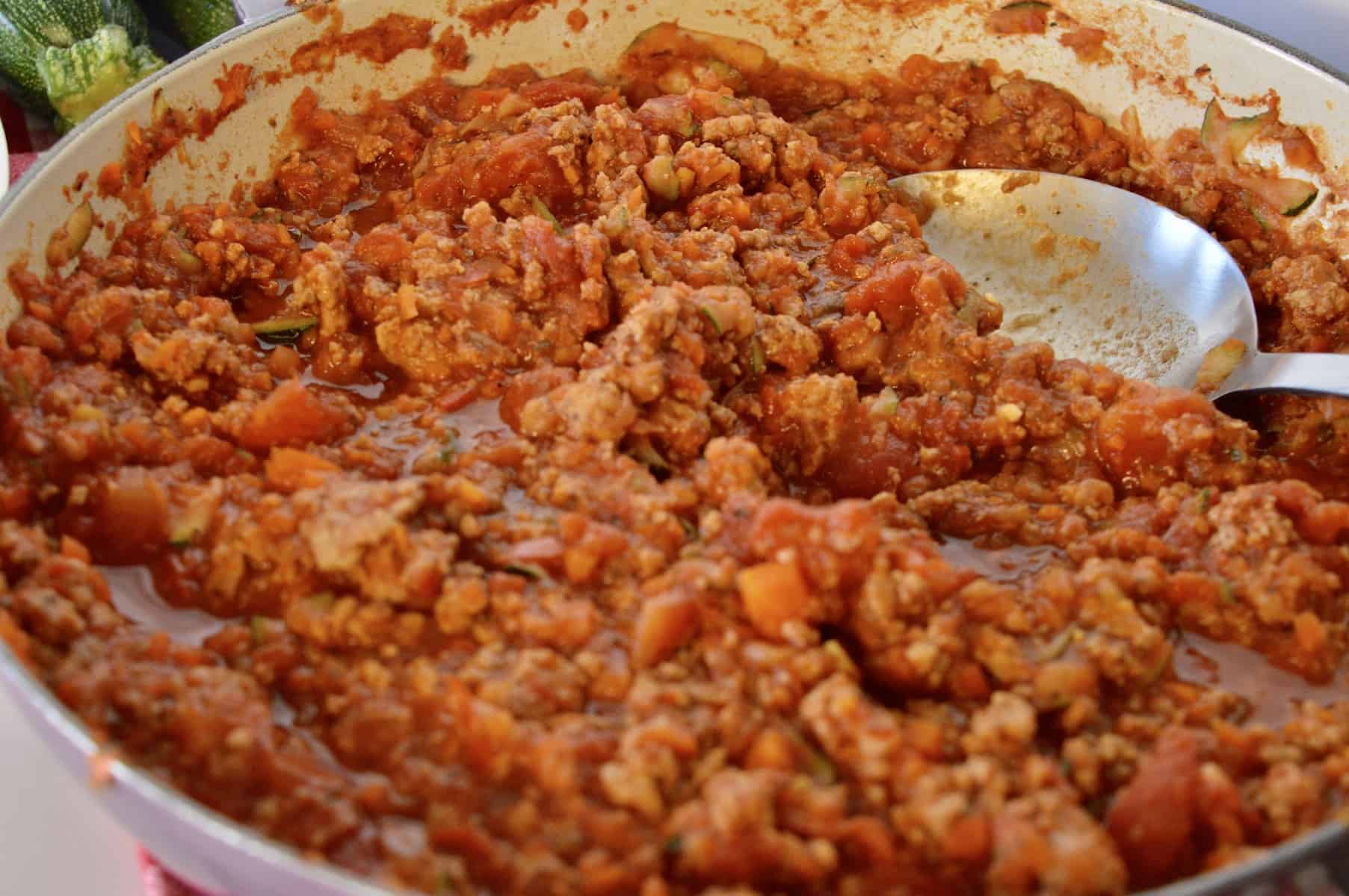 Close up of skillet with turkey vegetable sauce. 