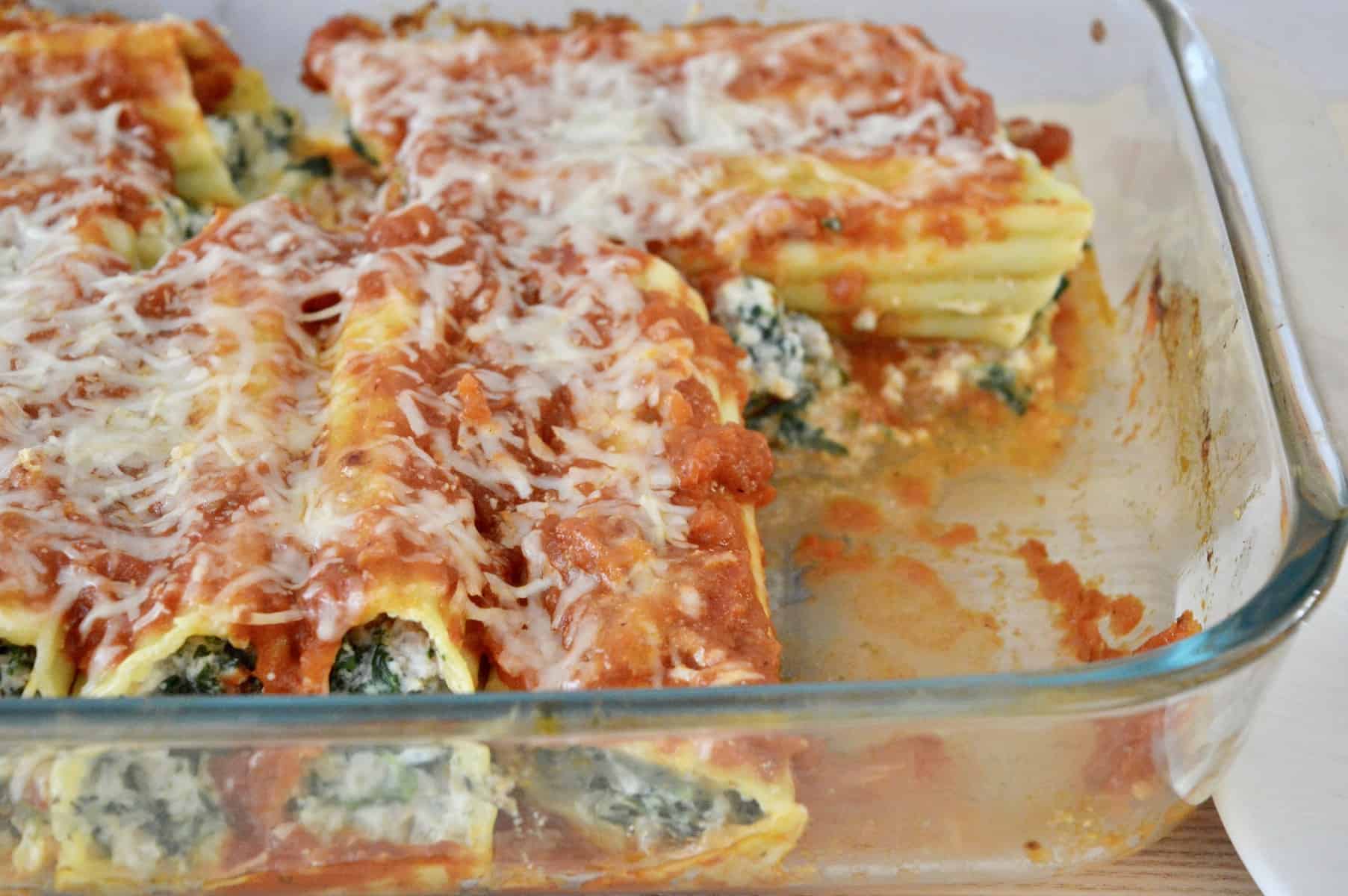 turkey spinach manicotti in a glass baking dish. 