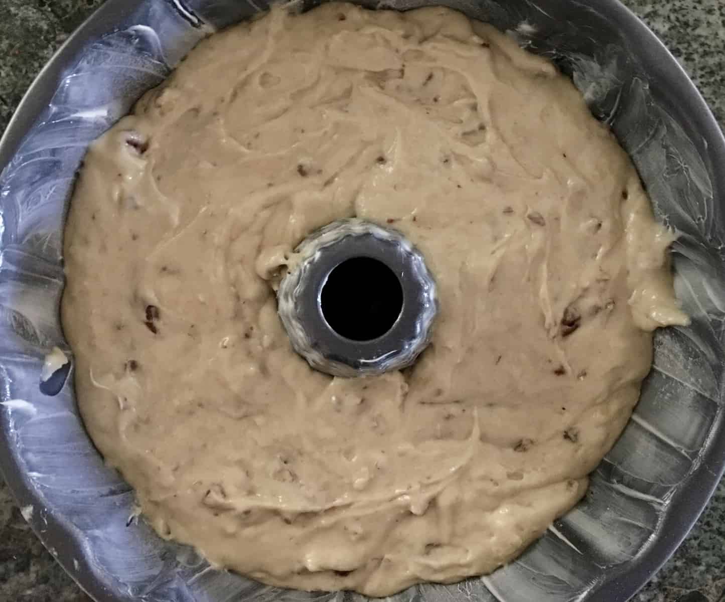 overhead photo of the batter in the cake pan. 