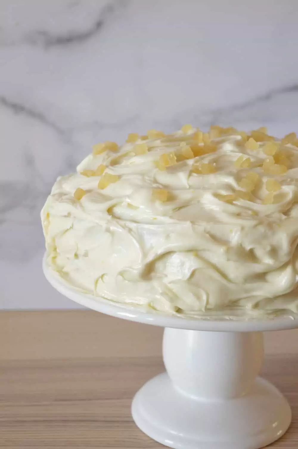 Limoncello Cream Cheese frosting spread all over the cake. 